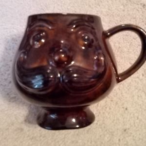 Holiday Designs USA brown ceramic face mug